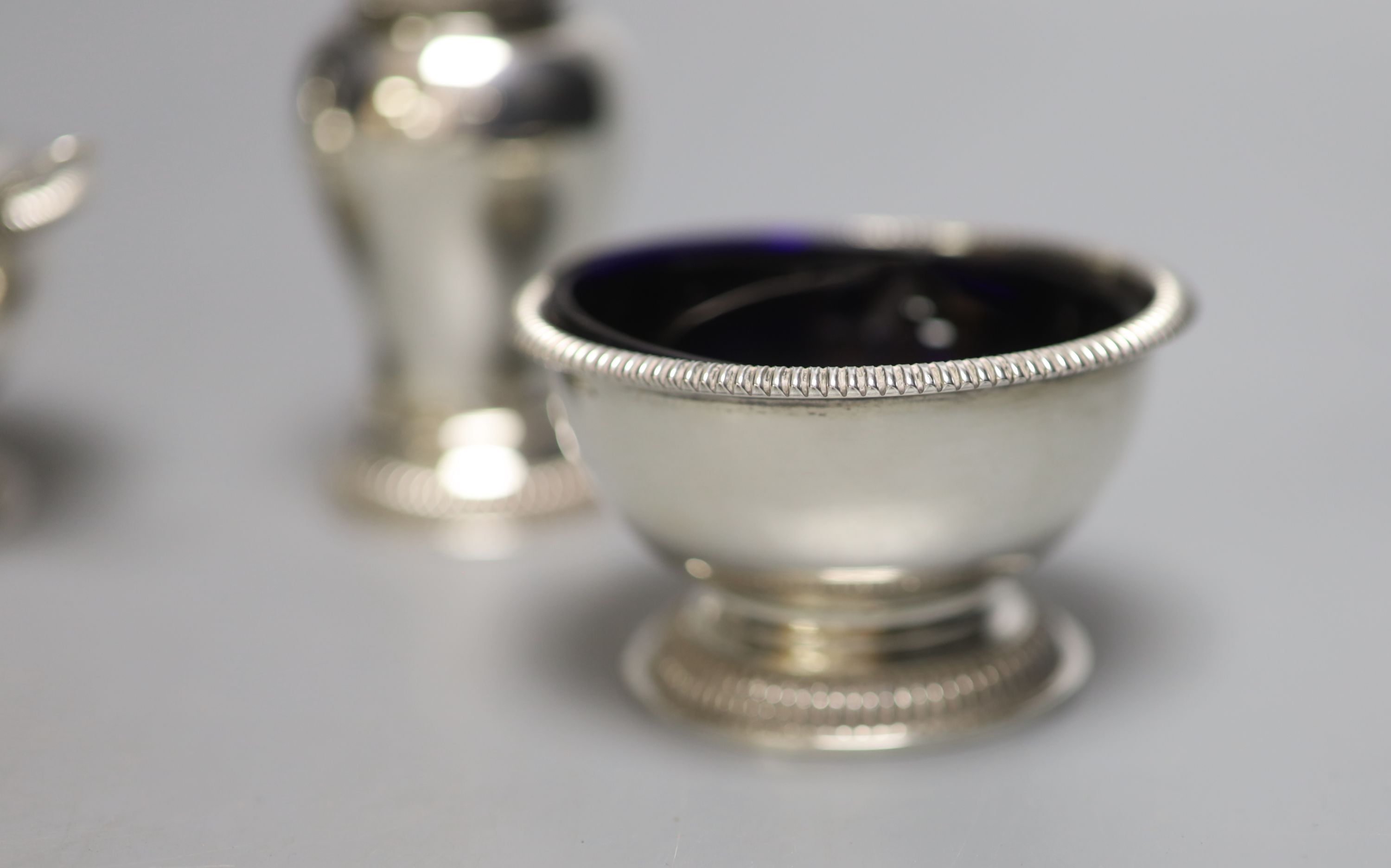 A modern silver five piece condiment set including one spoon, by William Comyns & Sons Ltd, London, 1960 & 1967,